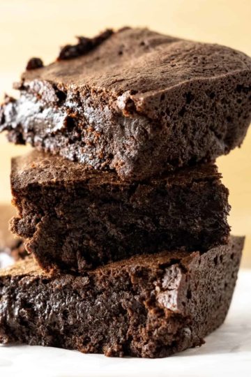 3 fudgy chewy brownies stacked on top of each other