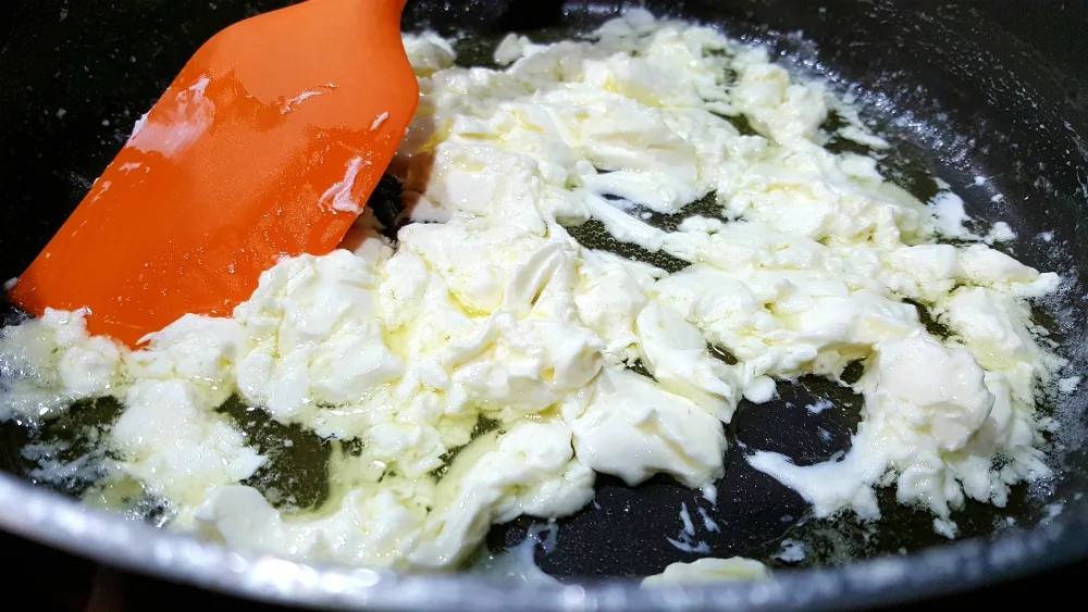 cream cheese and butter cooking in a pan