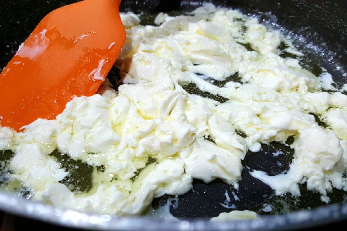 cream cheese and butter cooking in a pan.