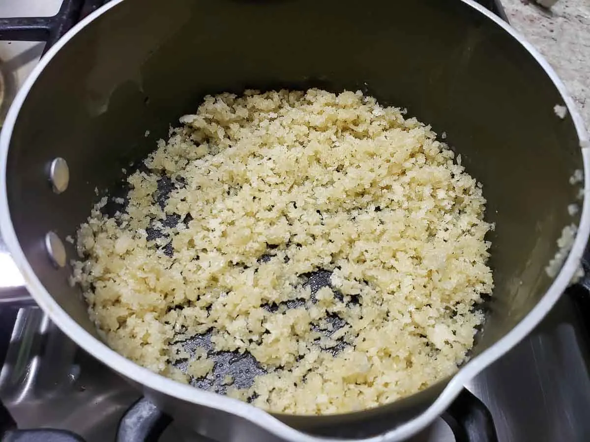 bread crumb and butter mixture cooking in a pan.