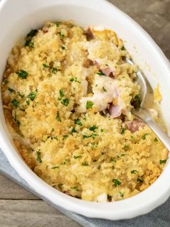 Low-carb Chicken Cordon Bleu Casserole close-up top down view with spoon digging into casserole