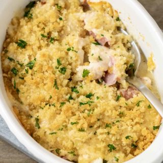 Low-carb Chicken Cordon Bleu Casserole close-up top down view with spoon digging into casserole