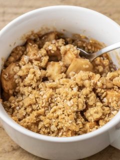 best Salted Caramel Apple Crisp top down view with a spoon