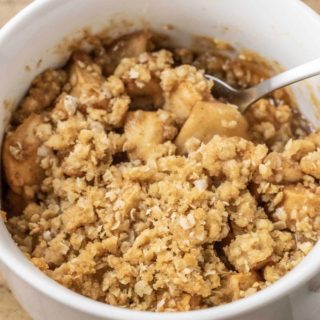 best Salted Caramel Apple Crisp top down view with a spoon