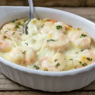 close up front view of Shrimp Scampi Pasta Bake in a dish with a spoon