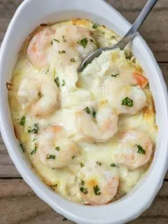 close up top down view of Shrimp Scampi Pasta Bake in a dish with a spoon