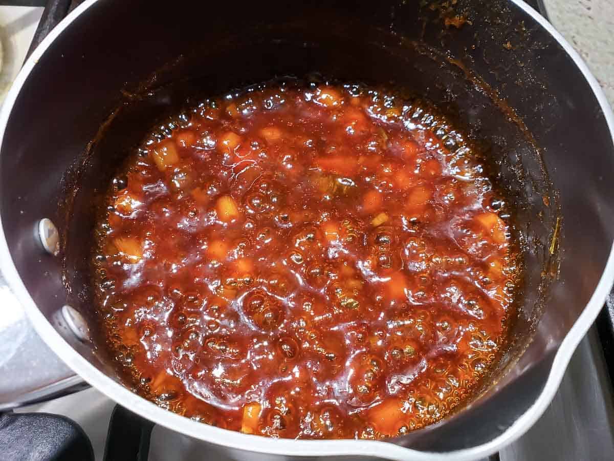 Sauce simmering in a pan.
