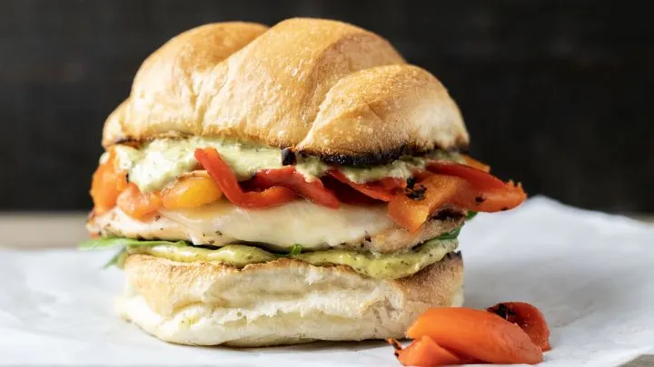 a Tuscan Grilled Chicken Sandwiches on parchement paper