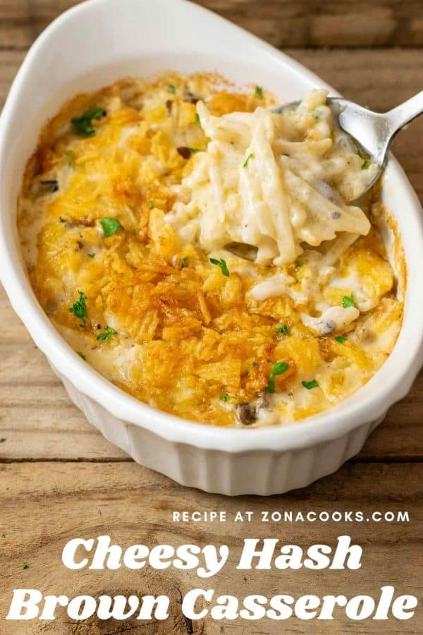 a graphic of Best Cheesy Hashbrown Casserole with a spoon lifting hash brown potato casserole out of the dish.