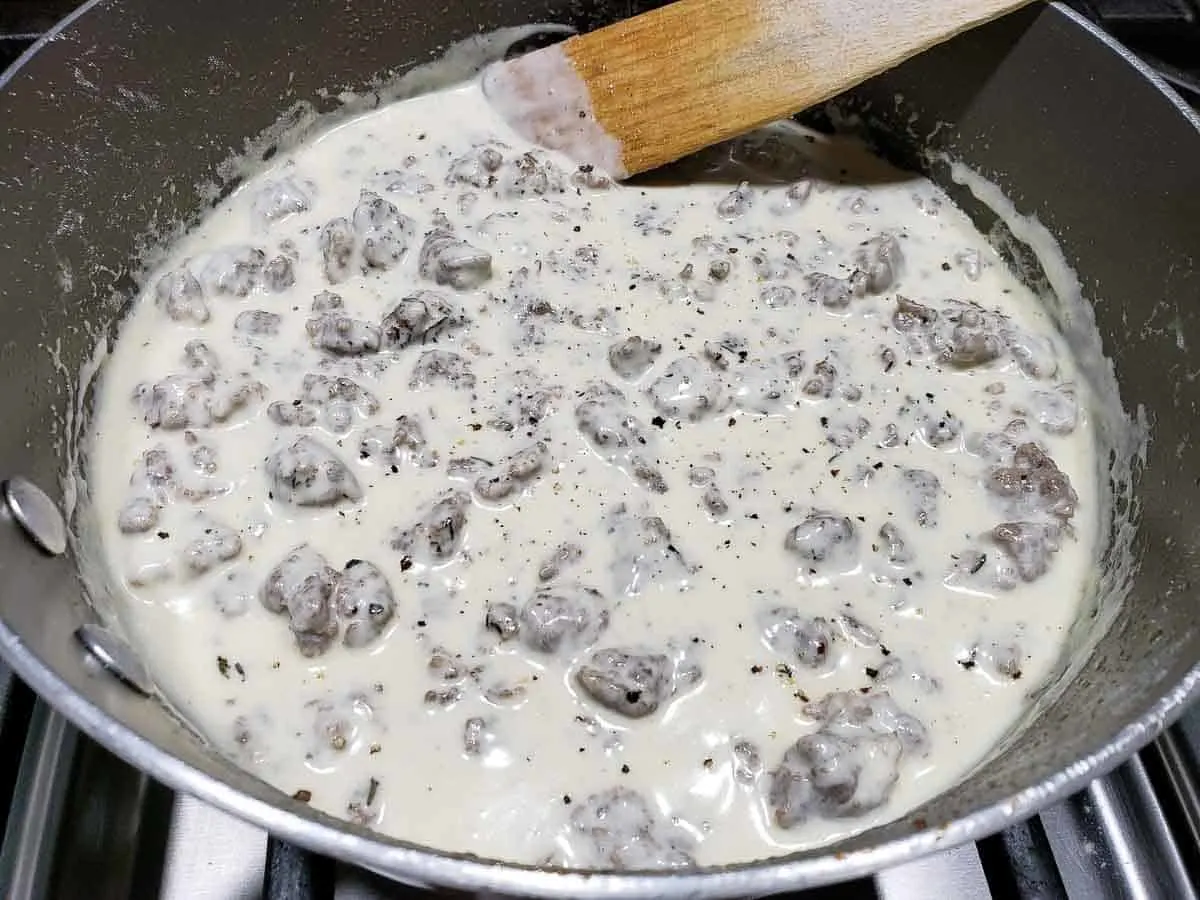 sausage gravy for 2 in a pan sprinkled with black pepper and thyme