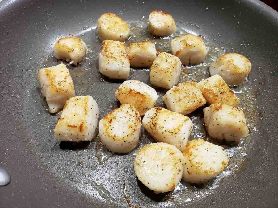 pan seared scallops in a pan