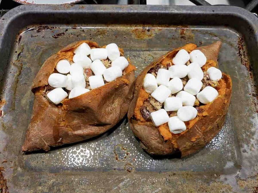 two sweet potatoes with mini marshmallow topping.