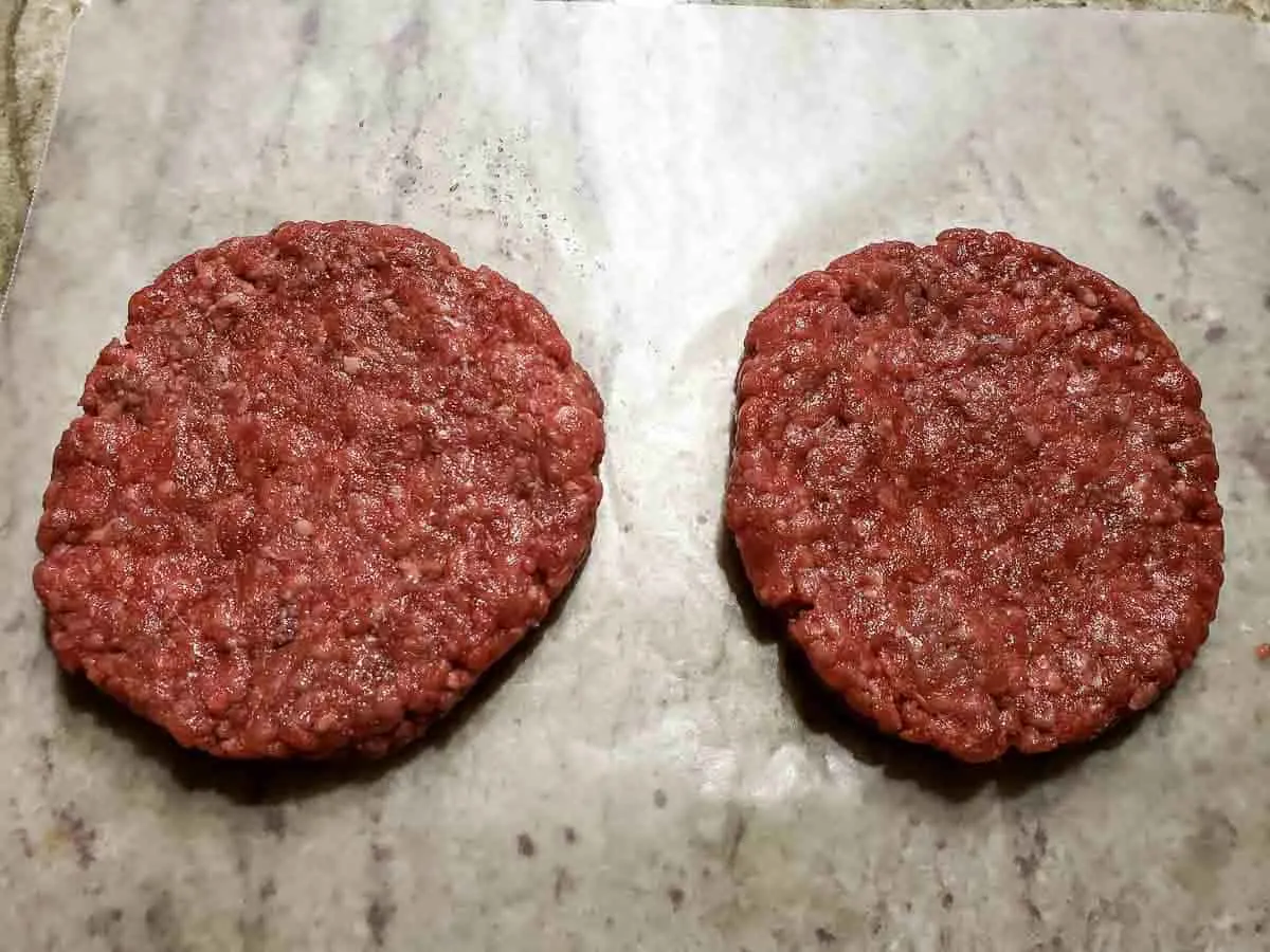 two burgers formed into patties.