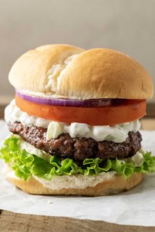 a big fat greek feta cheese burger on parchment paper