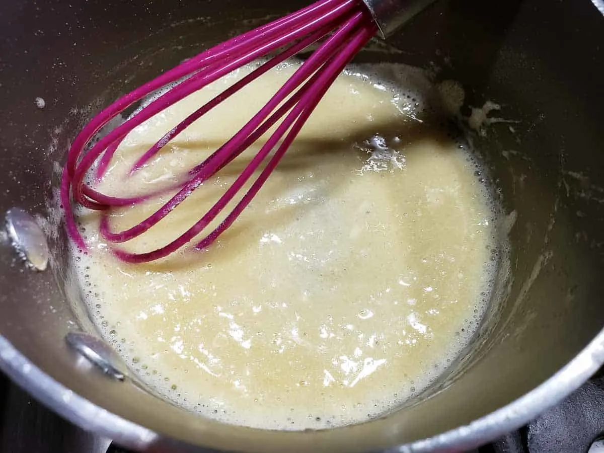 butter, flour, and pepper roux whisked in a pan