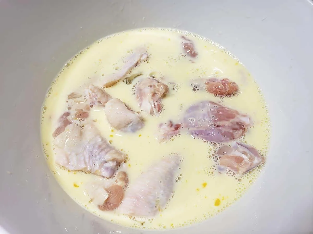 chicken wings soaking in homemade buttermilk mixture