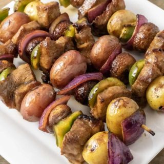 Four Easy Marinated Grilled Steak Kabobs on a platter