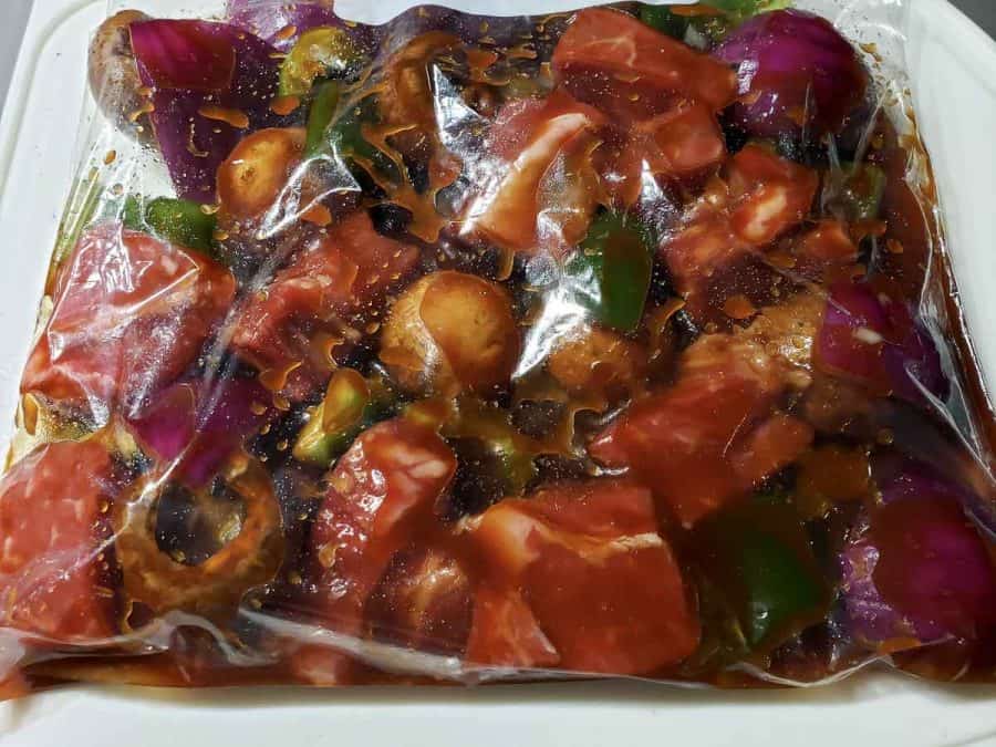 steak kabobs ingredients in a bag with marinade