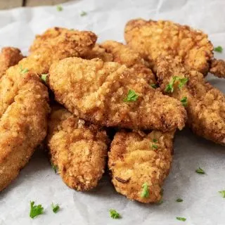 fried chicken tenders sprinkled with parsley