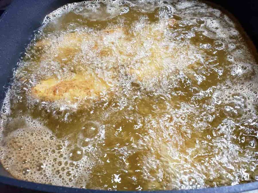 chicken fingers being deep fried
