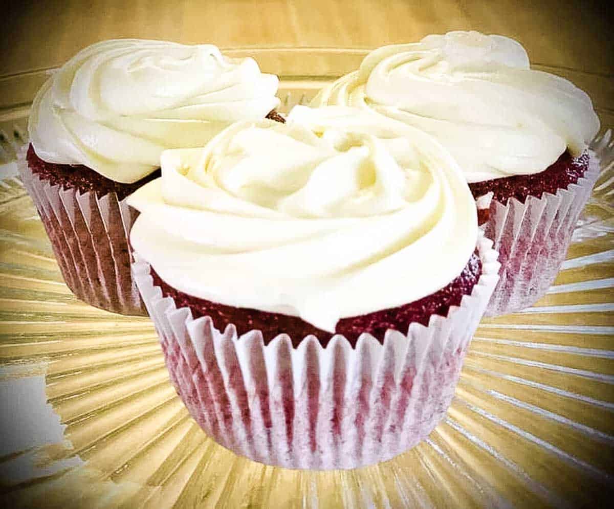 3 Red Velvet Cupcakes on a glass plate. Photo Credit - Melissa S.