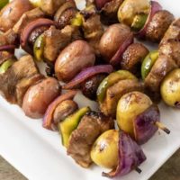 Four Easy Marinated Grilled Steak Kabobs on a platter