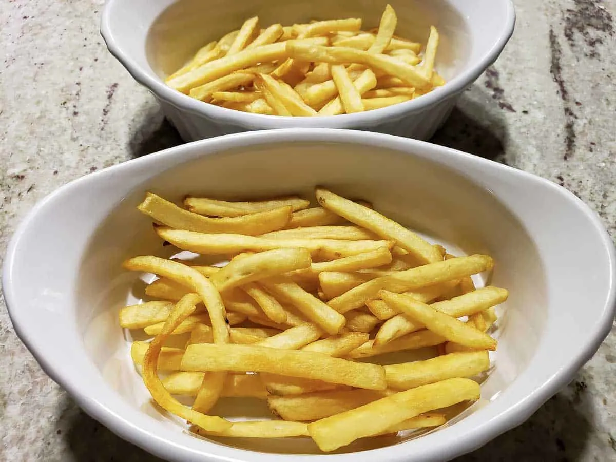 baked French fries in two casserole dishes