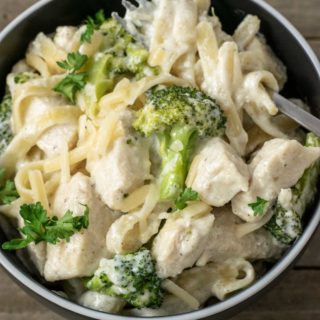 Chicken Fettuccine Alfredo with Broccoli in a bowl with a fork.