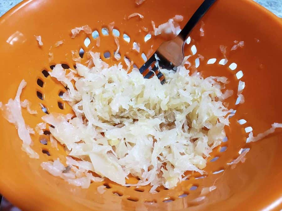 sauerkraut draining in a colander