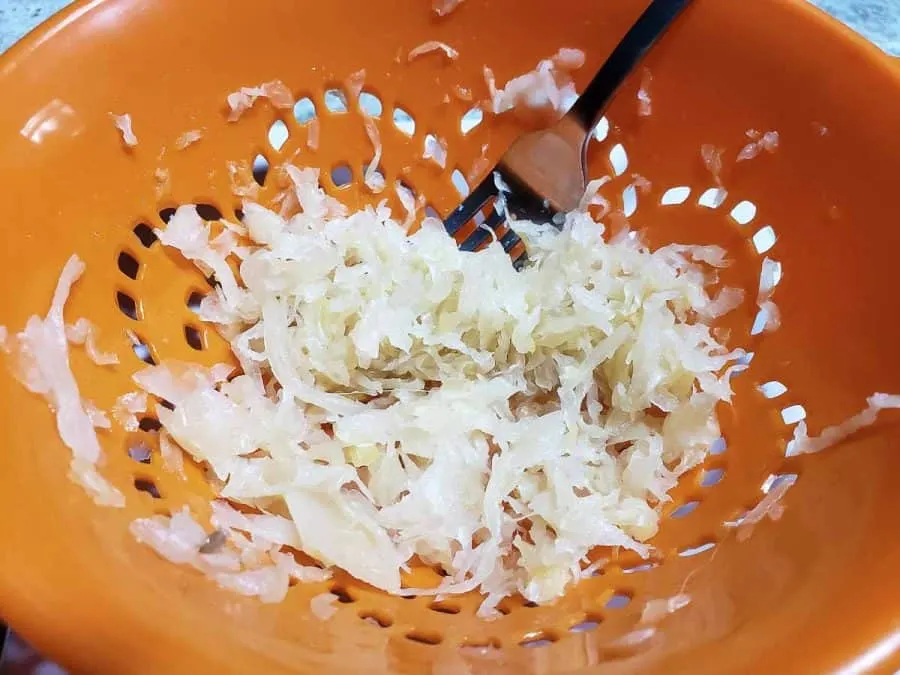 sauerkraut draining in a colander