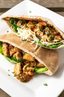 two half Italian Pita Bread Sandwiches on a plate