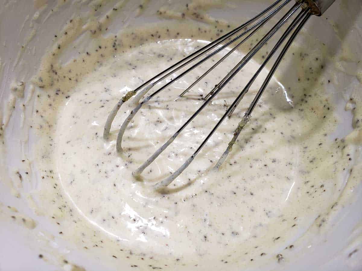 coleslaw dressing whisked in a bowl