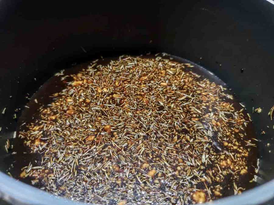 honey balsamic glaze cooking in a pan.