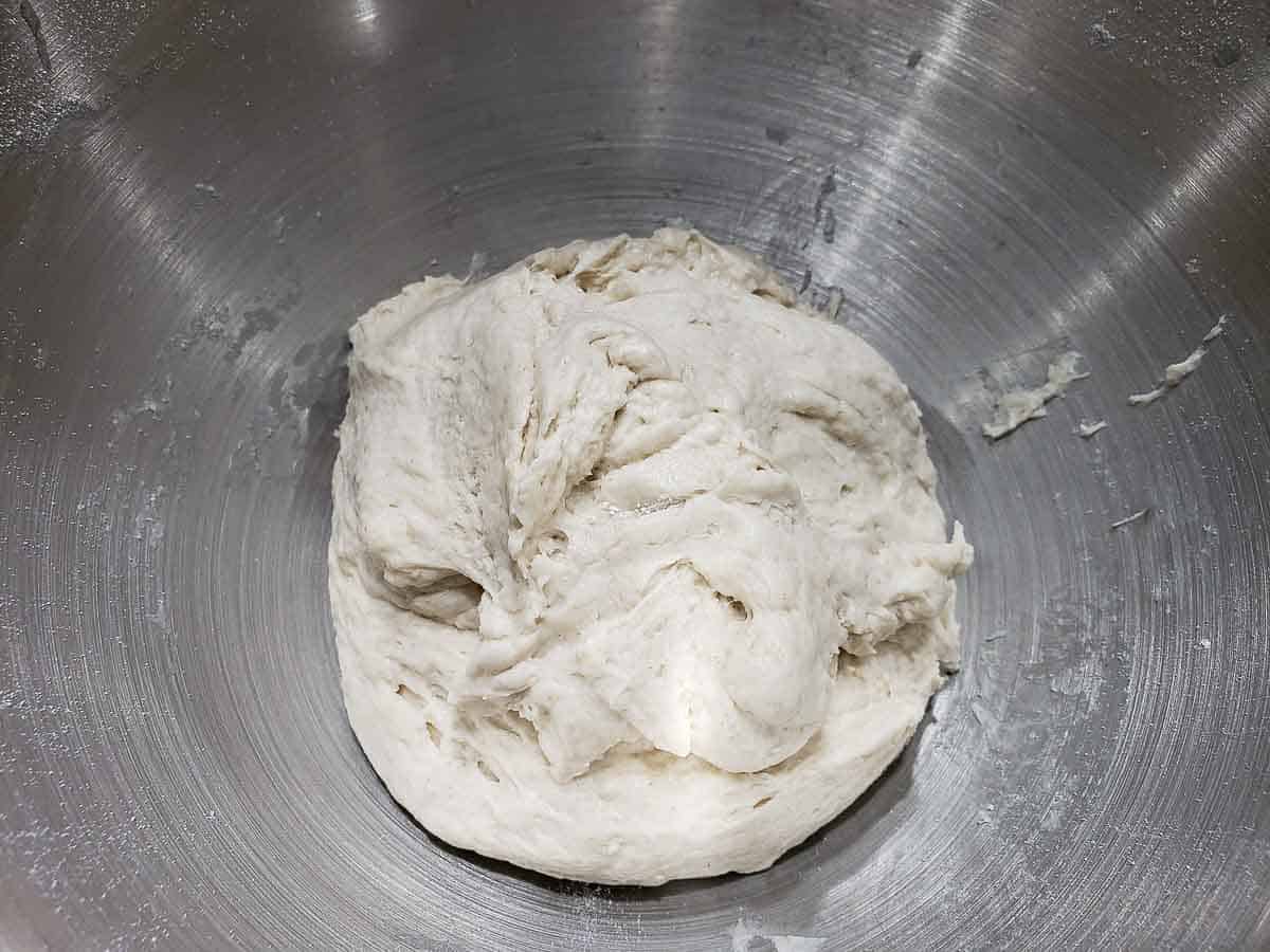 soft dough in a silver bowl.