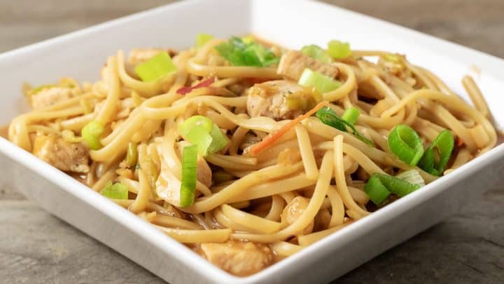 a baking dish filled with Thai Chicken Pasta