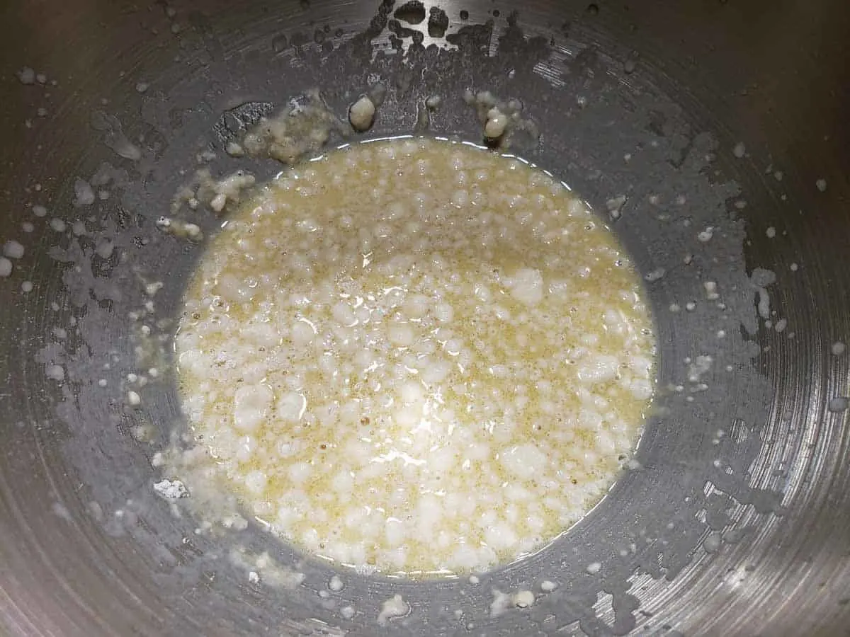 butter, salt, and a little flour added to yeast in a bowl
