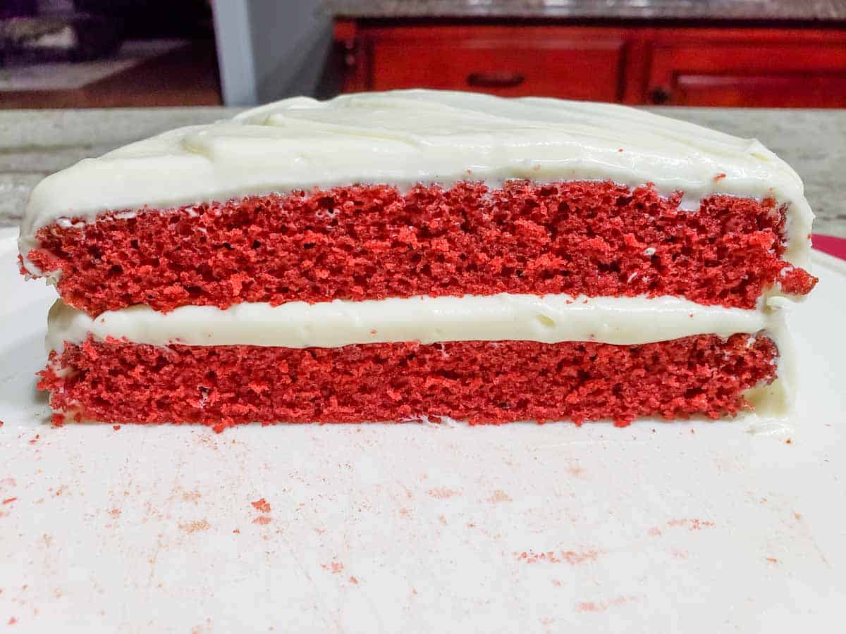 two half circles of red velvet cake stacked on top of each other