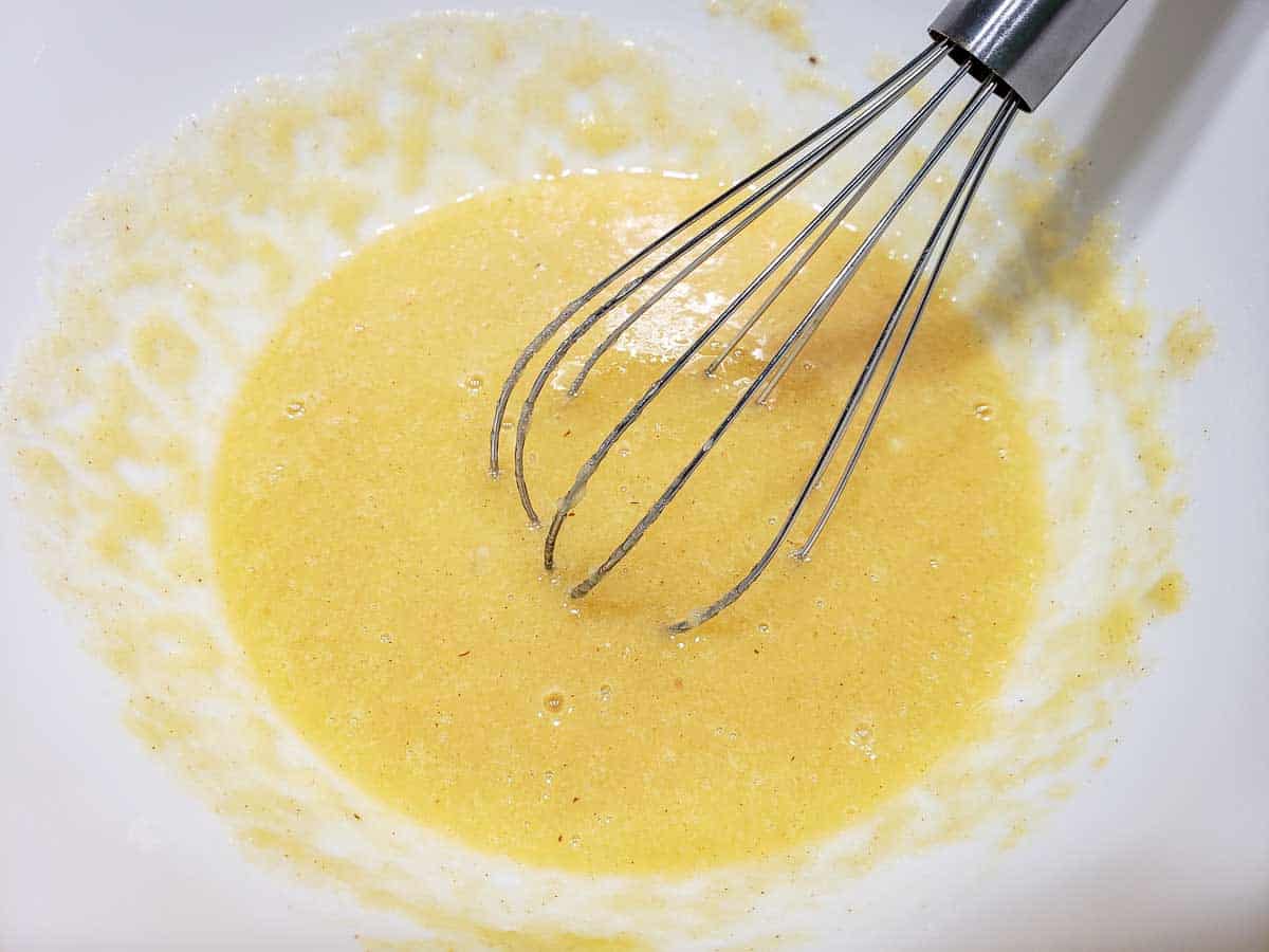 egg and applesauce mixture whisked in a bowl