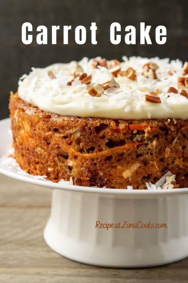 a graphic of a carrot cake topped with cream cheese on a cake stand and text reading carrot cake recipe at zonacooks.com