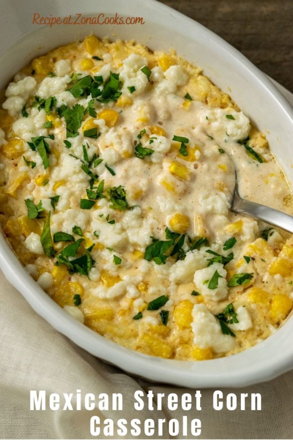 a casserole dish filled with corn, white cheese, chopped cilantro and creamy sauce and text reading mexican street corn casserole