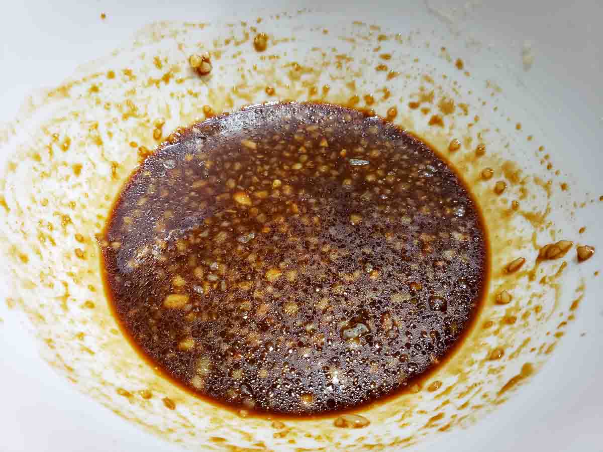 a bowl filled with brown garlic sauce.
