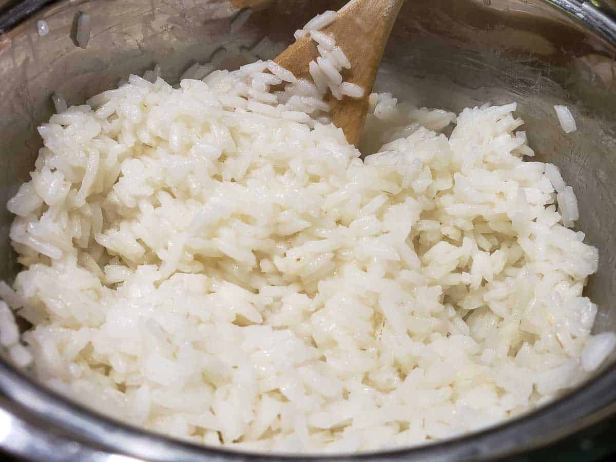 white rice cooking in a sauce pan.