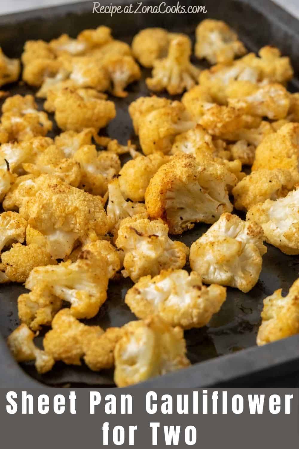 a small baking sheet pan filled with golden brown oven baked cauliflower florets and text reading recipe at zonacooks.com sheet pan cauliflower for two