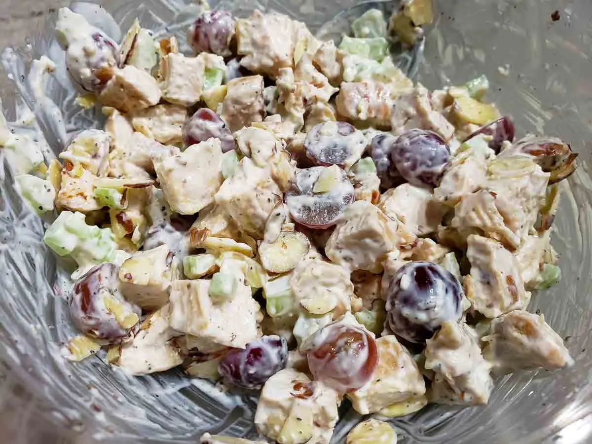 chicken salad mixed together in a bowl.
