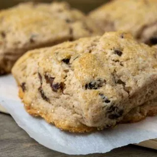 fluffy golden brown scones filled with cinnamon and raisins and topped with coarse sugar