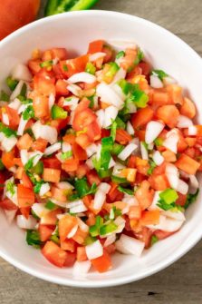a bowl of salsa fresca pico de gallo.