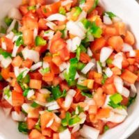 a bowl of salsa fresca pico de gallo.