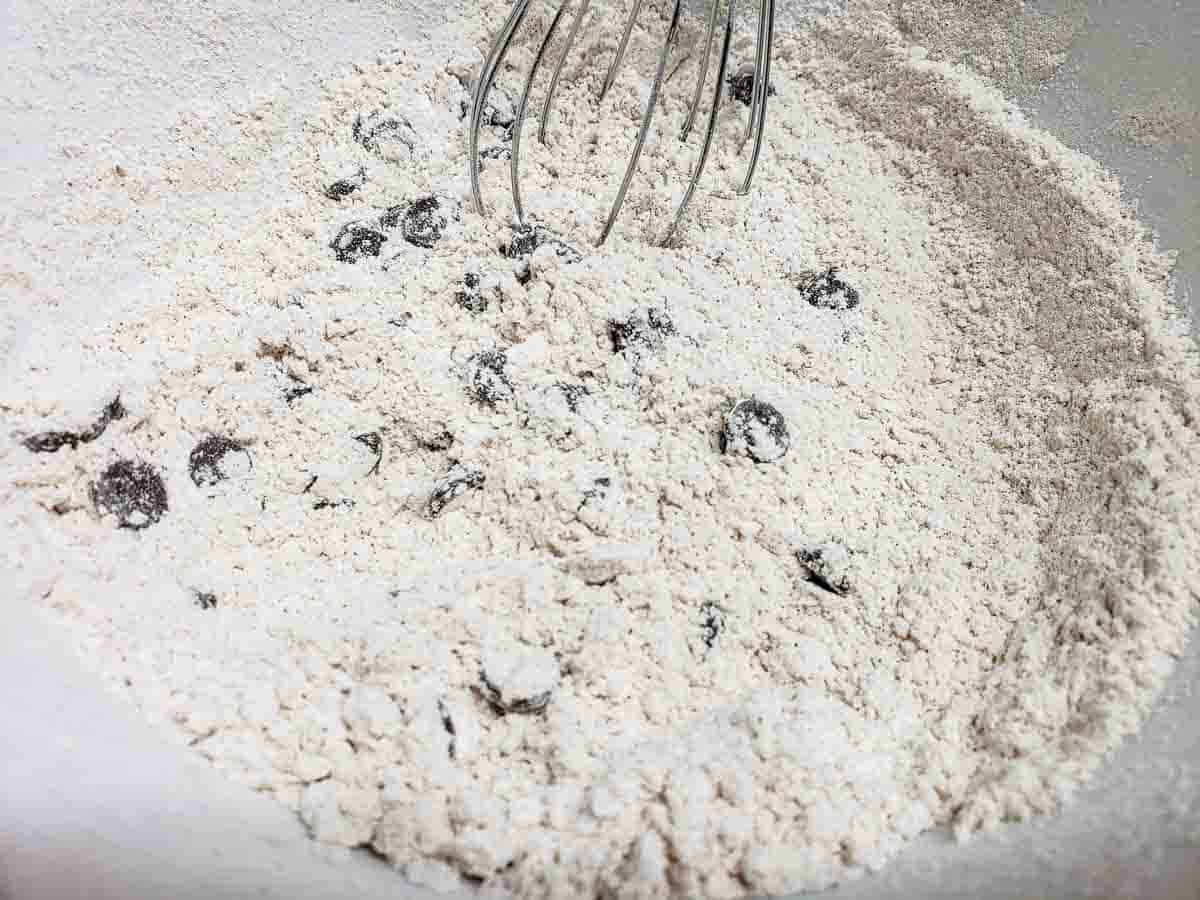 flour and chocolate chip mixture whisked in a bowl.