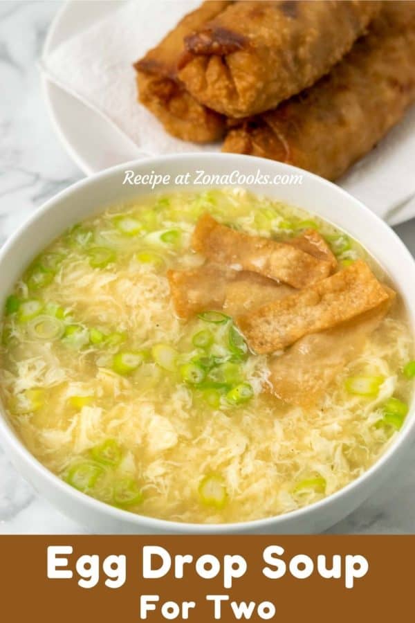 a bowl of egg drop soup and crispy wonton croutons with a side of eggrolls and text reading recipe at zonacooks.com egg drop soup for two.