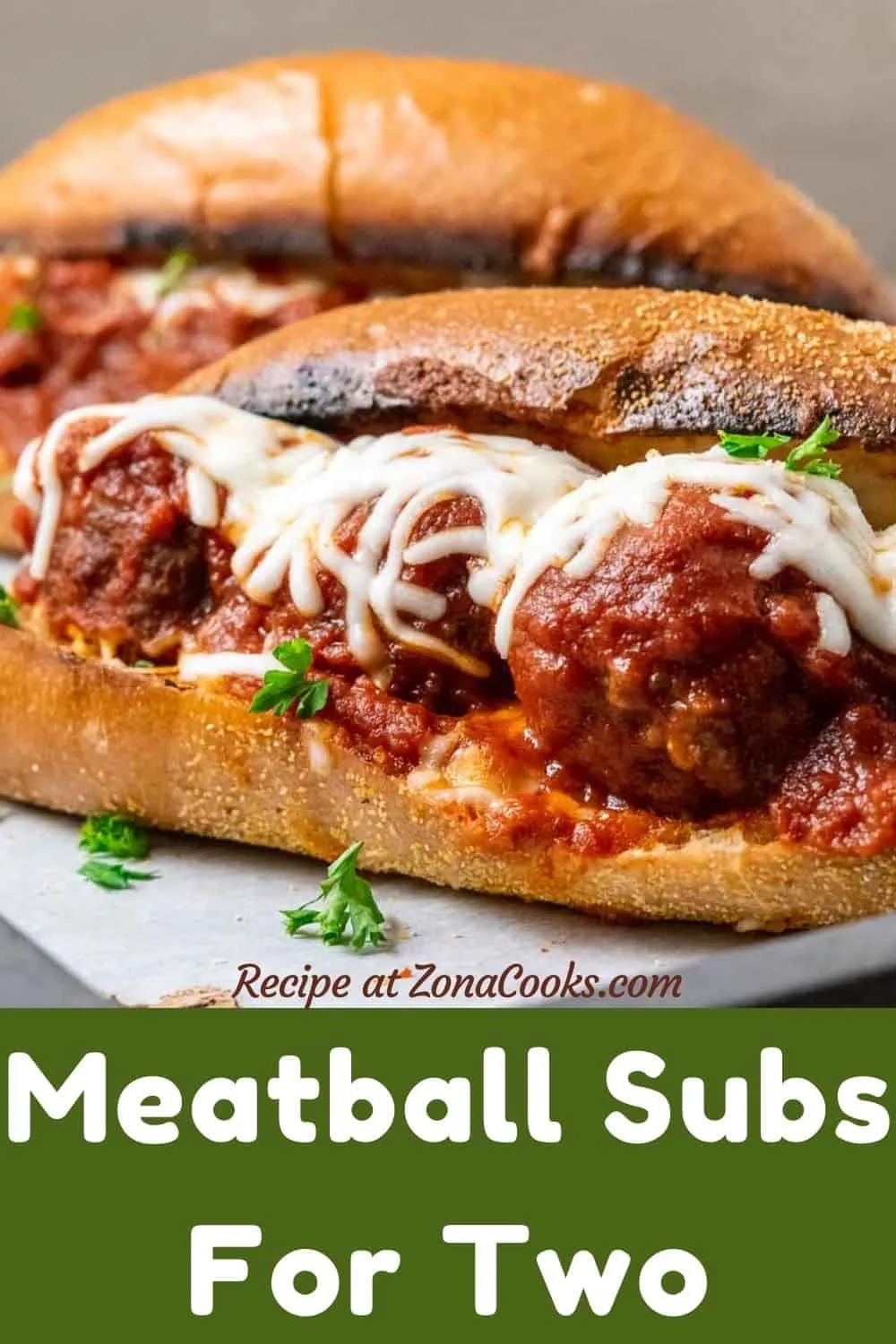 two meatball subs on a tray and text reading recipe at zonacooks.com meatball subs for two.